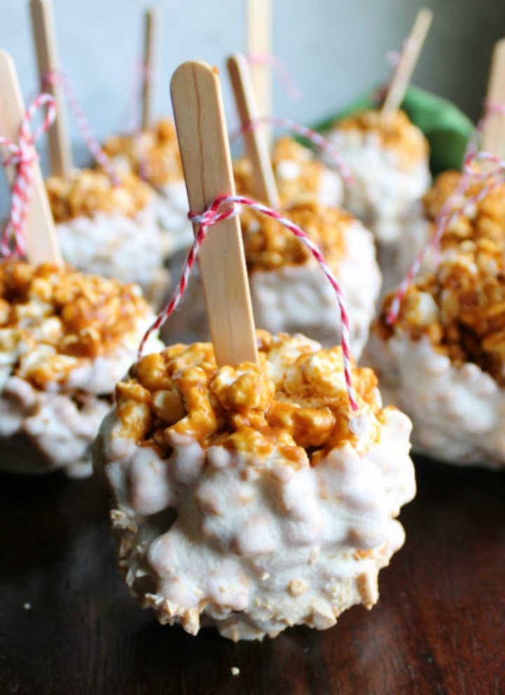 close up white chocolate dipped caramel apple popcorn balls