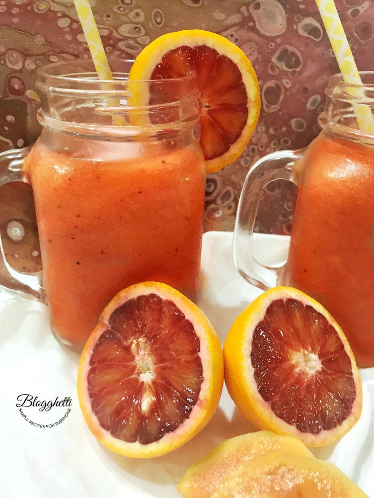 Blood Orange Strawberry Papaya Daiquiri with fruit in picture