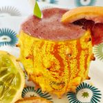 kiwano melon and blood orange smoothies in kiwano shell - close up