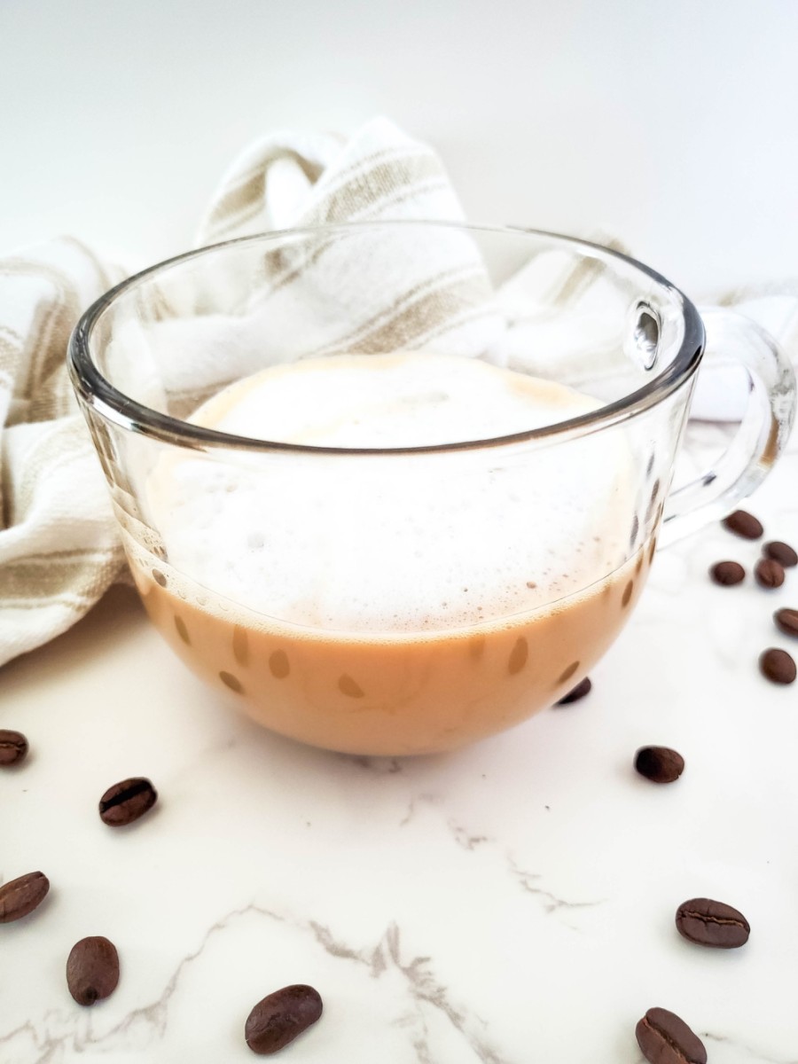 vanilla caramel apple latte in glass cup