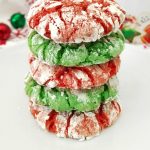 Christmas Crinkle Cookies stacked on white plate
