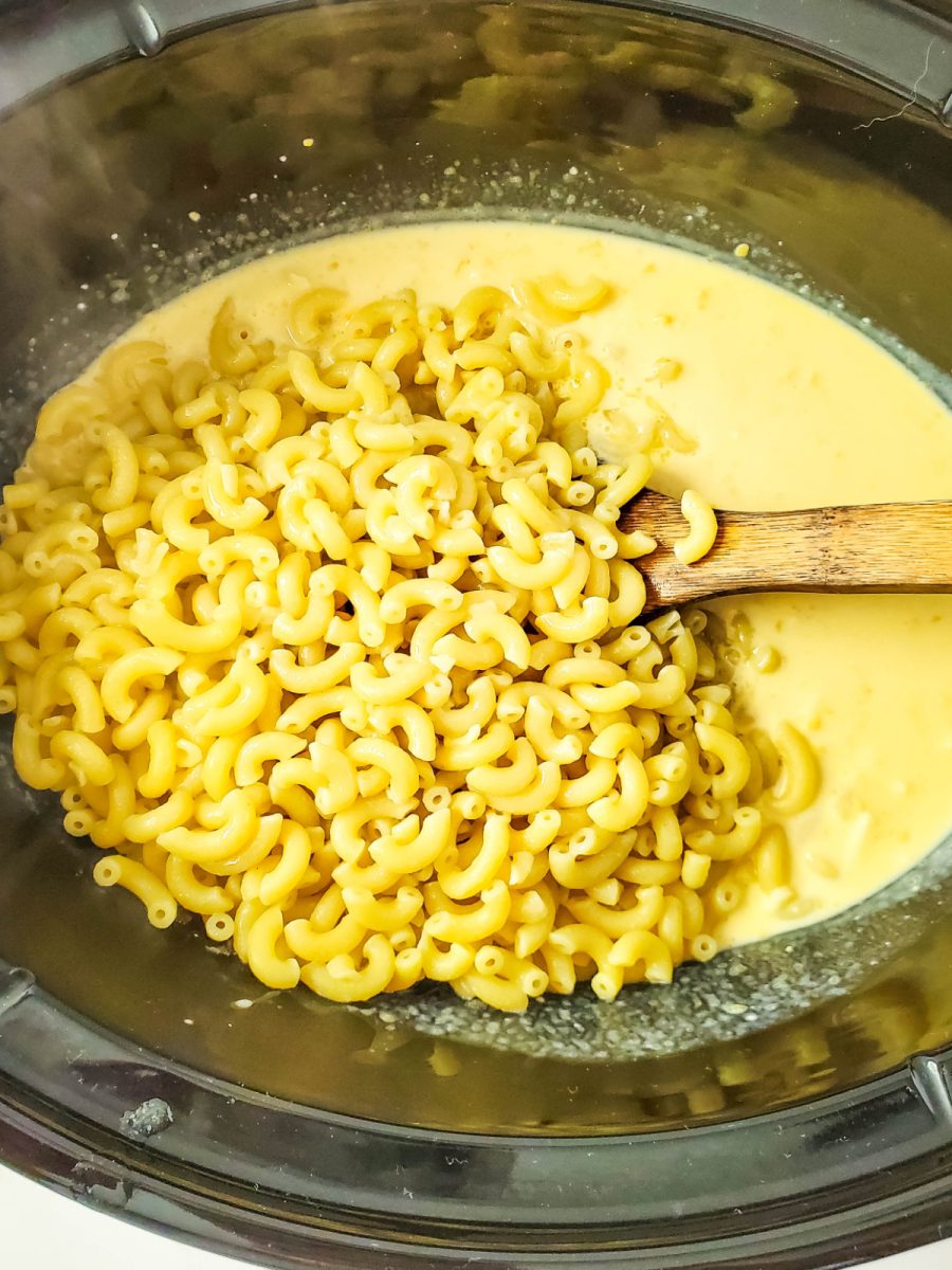 add pasta to slow cooker with cheese sauce