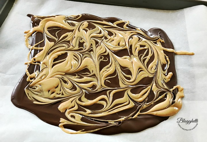 swirling the melted peanut butter chips into the chocolate