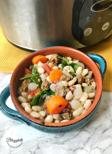 bowl of Tuscan White Bean Soup with Sausage made in the slow cooker