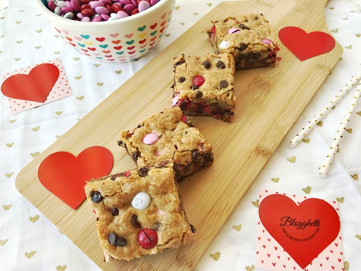 Valentine's M&M Cookie bar squares on wooden board