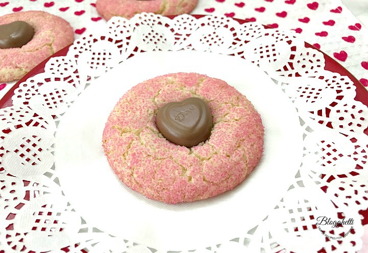 single pink crinkle cookie on plate