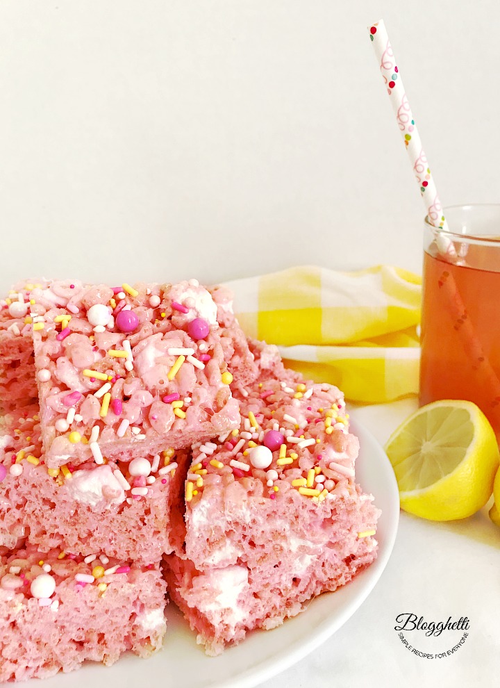 Pink Lemonade Rice Krispie Treats cut into squares on plate