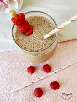 Raspberry almond coffee smoothie in clear glass