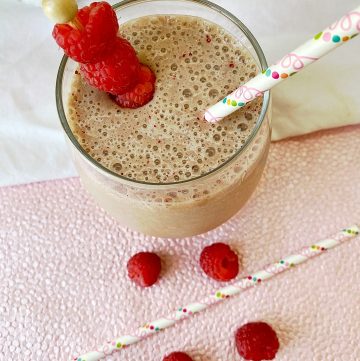 Raspberry almond coffee smoothie in clear glass