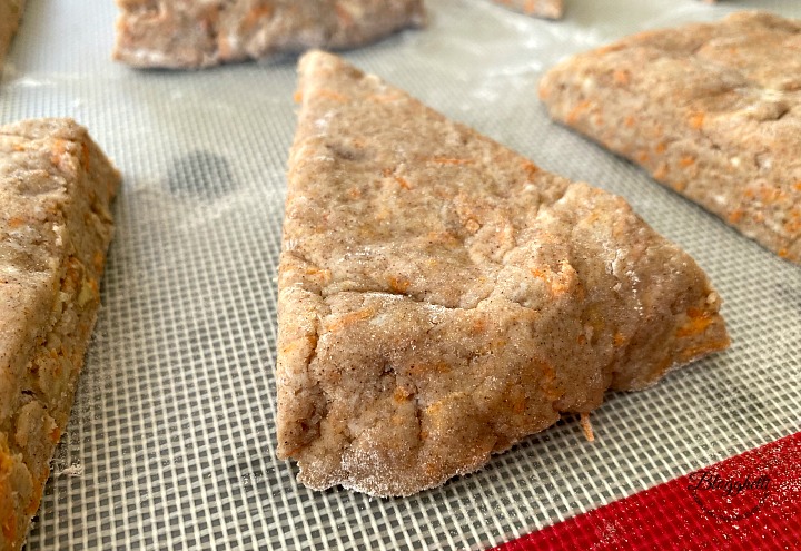 carrot cake scone dough cut into wedges