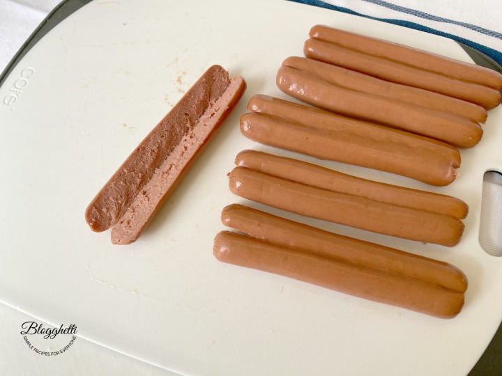 cutting hot dogs in half lengthwise