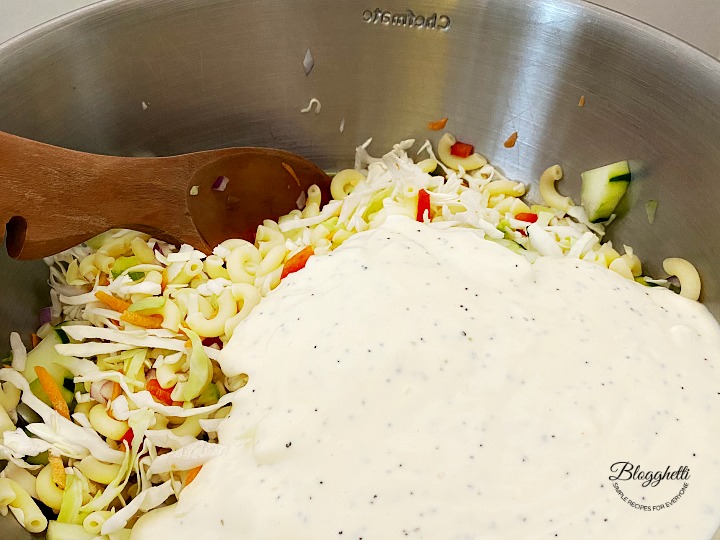 Mixing the Macaroni Coleslaw Salad in large bowl