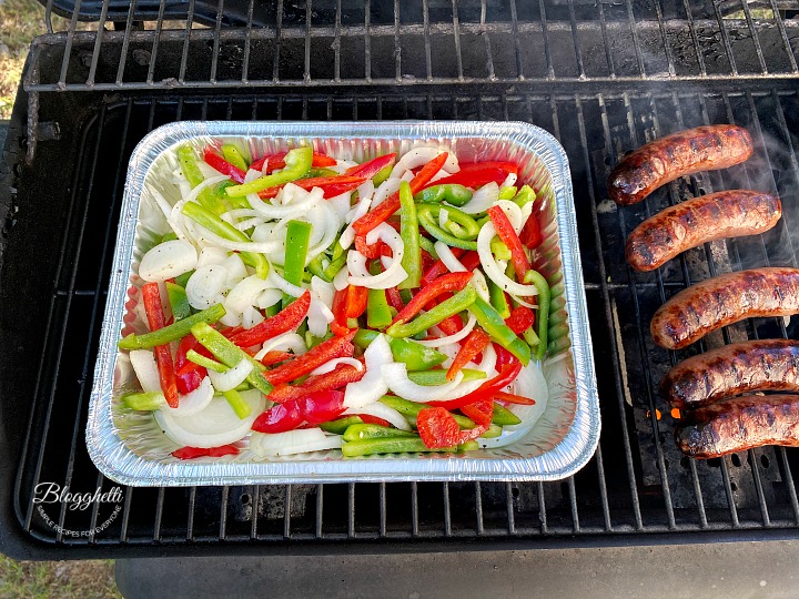 grilling the vegetables and sausages