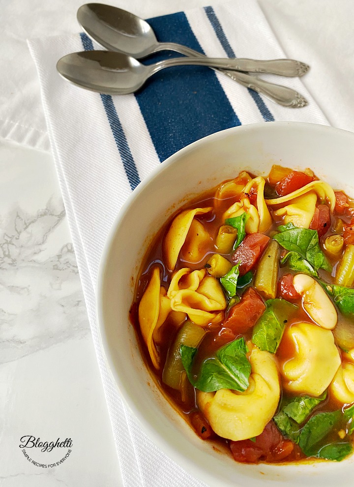 white bowl filled with Vegetablr Tortellini Soup