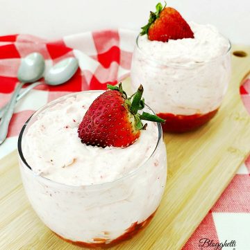 Easy Strawberry Mousse in dessert glasses with a strawberry garnish