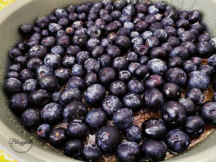 blueberries with brown sugar topping in cake pan