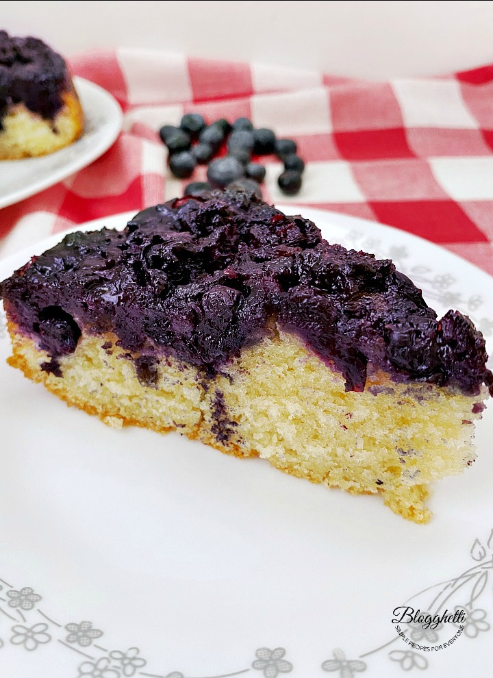 slice of blueberry upside down cake on plate
