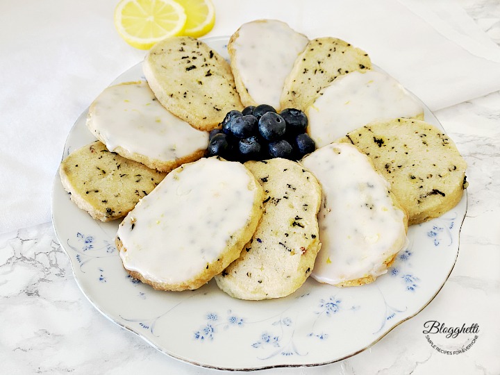 Plate of Blueberry Earl Grey Shortbread Cookies with Lemon Glaze