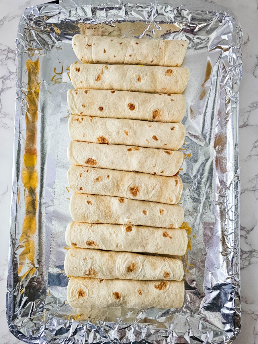 place taquitos on baking sheet