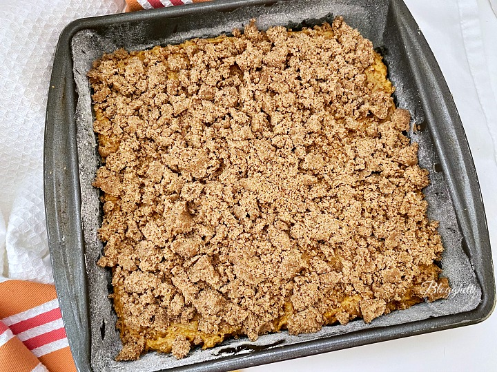Pumpkin Spice Coffee Cake batter with streusel topping ready to bake