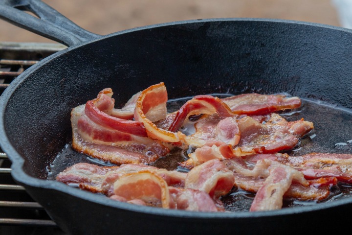 frying bacon in skillet