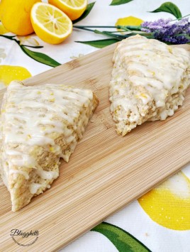 glazed lemon lavender scones on wooden board