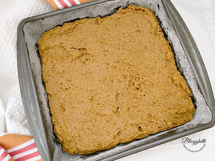 pumpkin spice coffee cake batter in baking pan