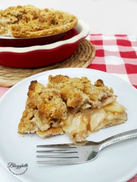 slice of Amish Pear Crumb Pie on white plate with fork