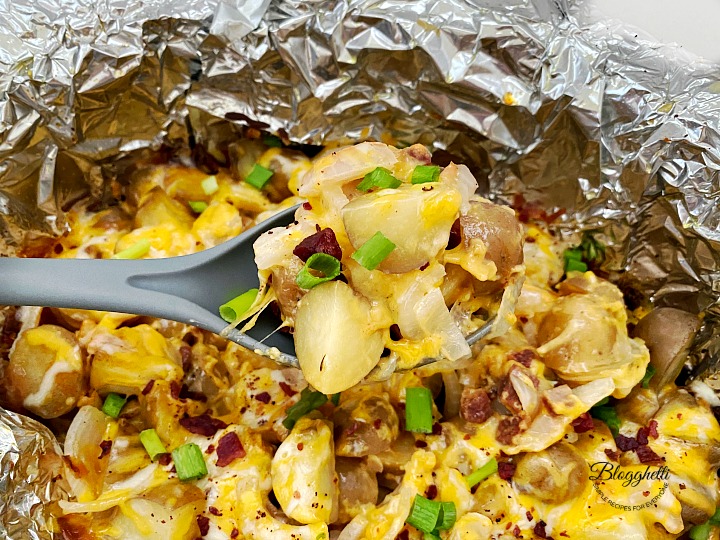 spoonful of slow cooker loaded cheesy potatoes