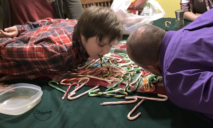 Candy Cane Bobbing Game with the guys taking a turn