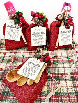 Gift bags decorated for Christmas with cookie mix inside