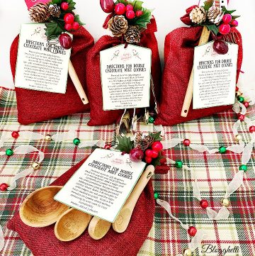 Gift bags decorated for Christmas with cookie mix inside