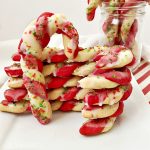 Candy Cane cookies stacked on white plate