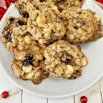 Plate of cranberry pecan oatmeal cookies with holiday decor