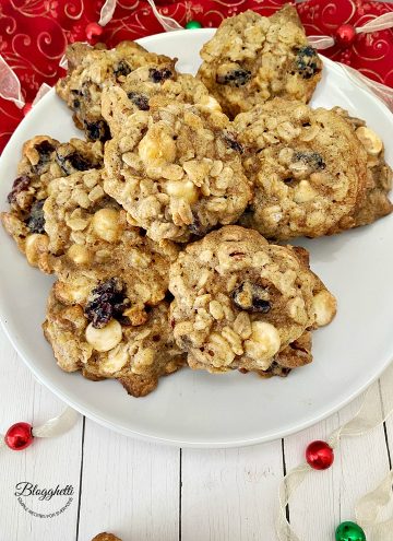 Plate of cranberry pecan oatmeal cookies with holiday decor