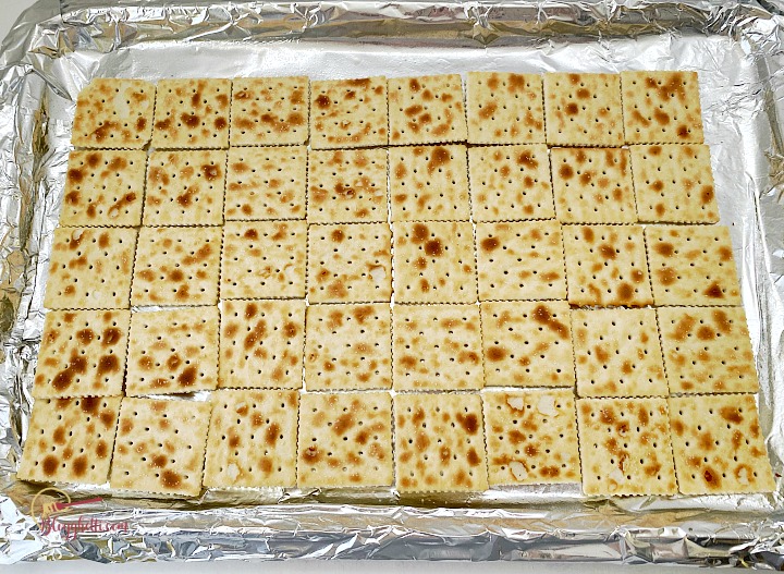 sheet pan with saltine crackers laid out for crack candy