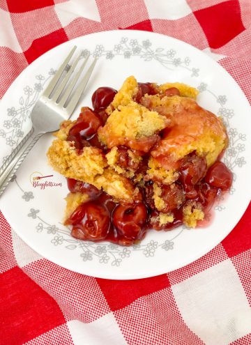 cherry cobbler served on white and gray plate