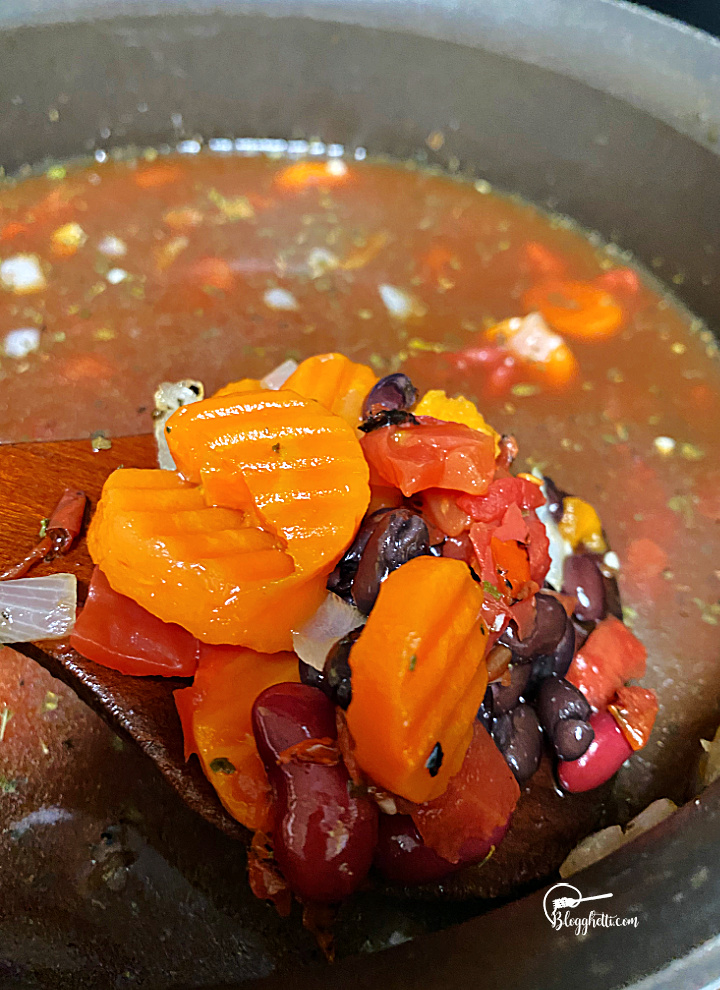 two bean soup simmering in Dutch Oven