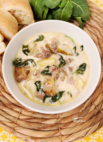zuppa toscana soup in white bowl made in the slow cooker