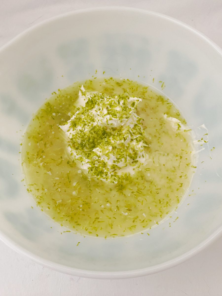 Key lime juice, zest and cream cheese in bowl - updated