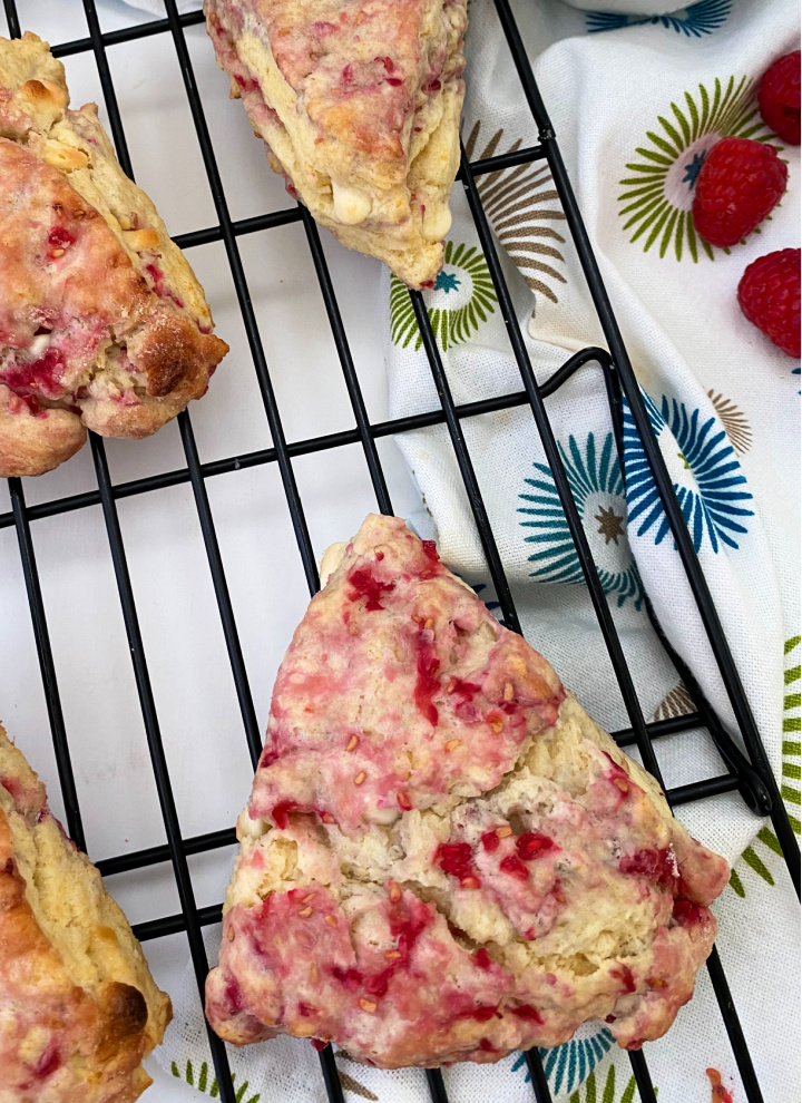 baked white chocolate raspberry scone on cooling rack