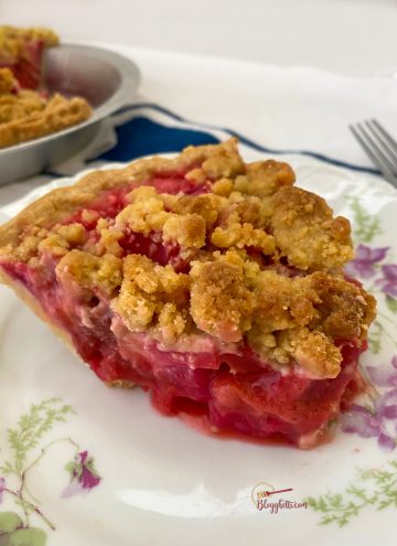 close up of strawberry rhubarb pie on plate
