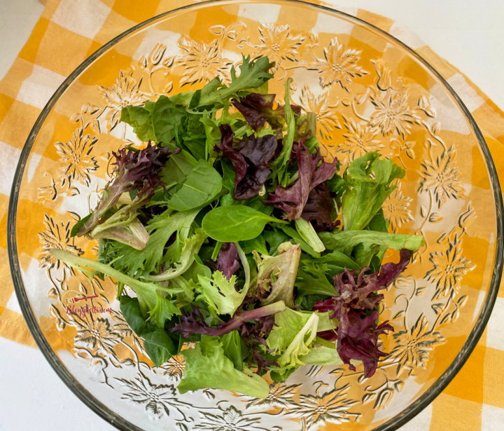 crystal salad bowl with spring greens