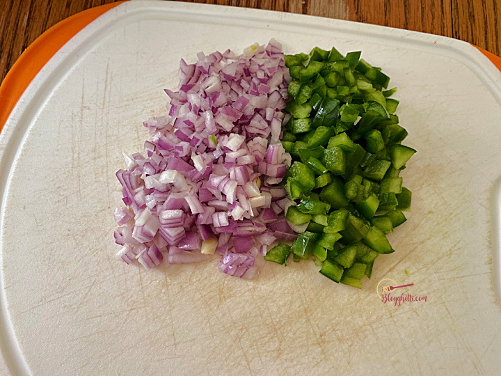 diced onion and bell peppers on cutting board