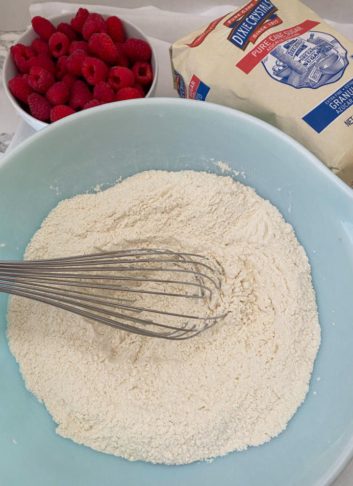mixing dry ingredients for scones in large bowl