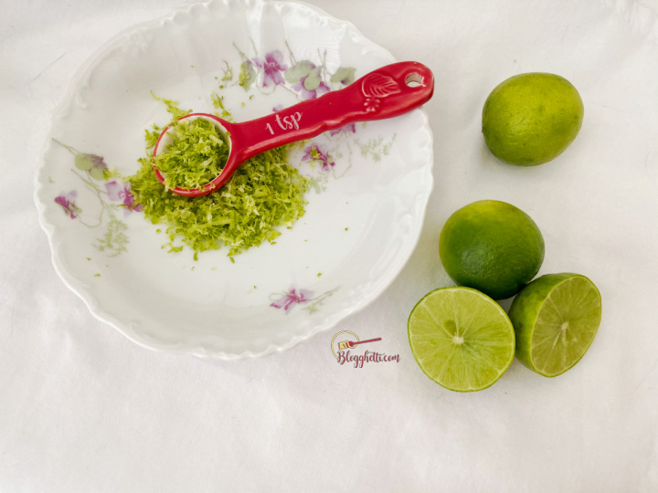 zest of key limes in white bowl with limes on the side