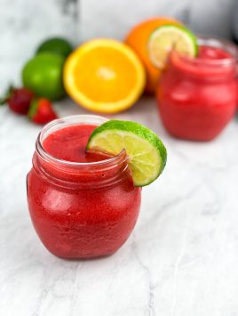 garnish glasses with lime slices and serve