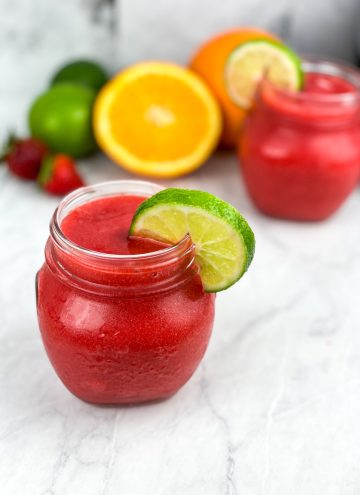 garnish glasses with lime slices and serve