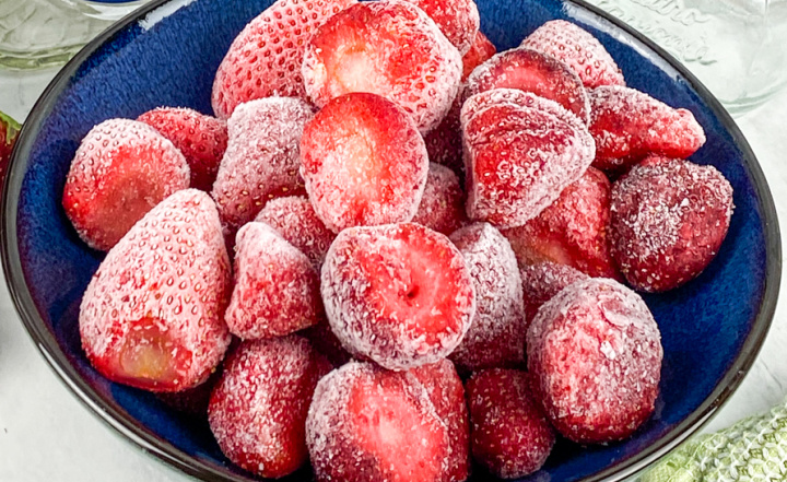 frozen strawberries in blue bowl