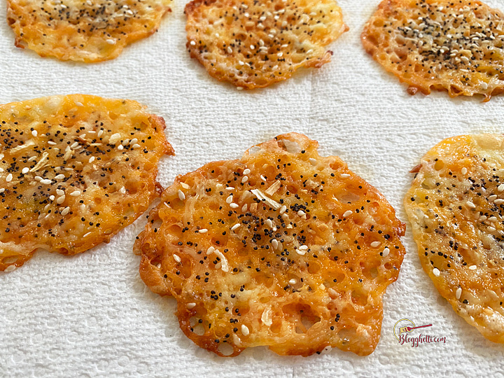 Cheese chips with everything bagel seasoning cooling on paper towel